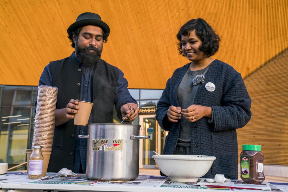 Partizaning Maunula, Ali and Vidha serving soup at the event