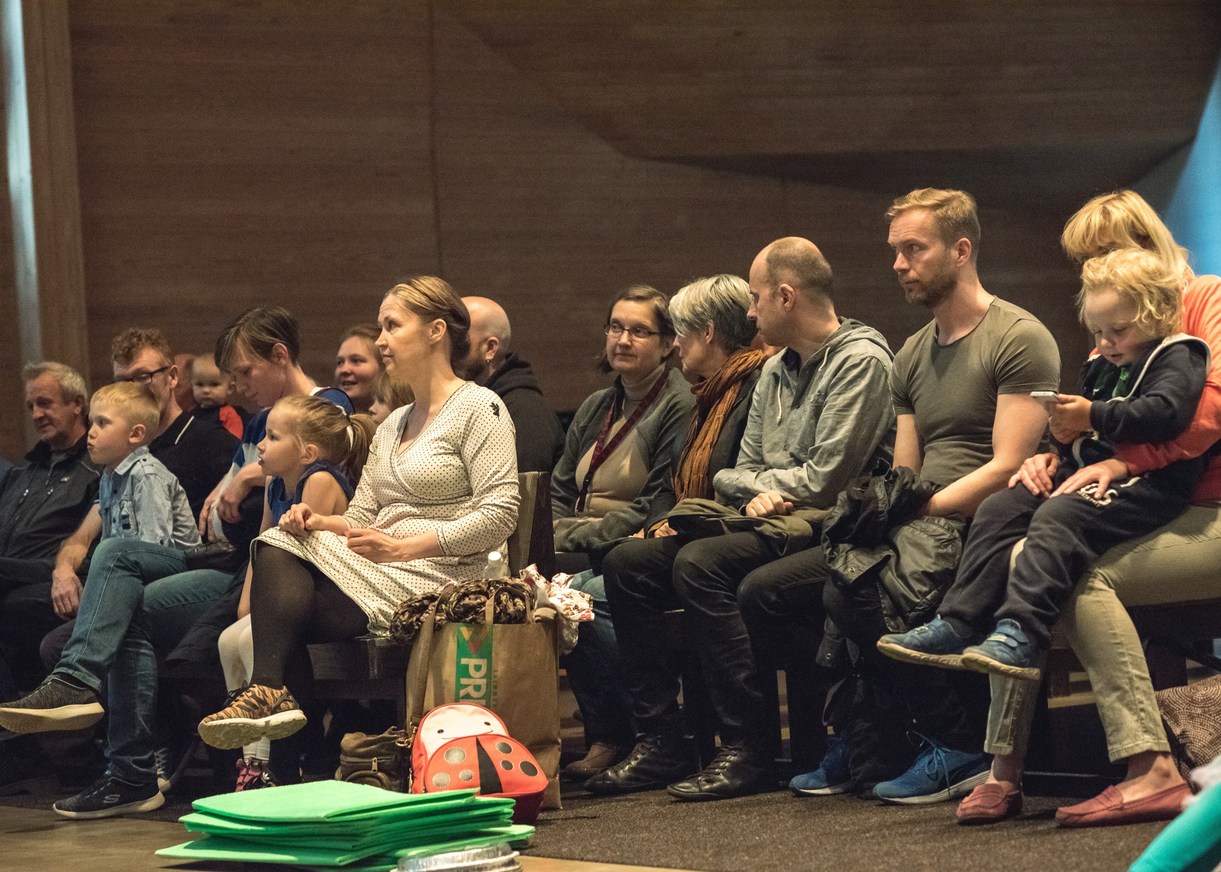 People of different ages sitting in the audience