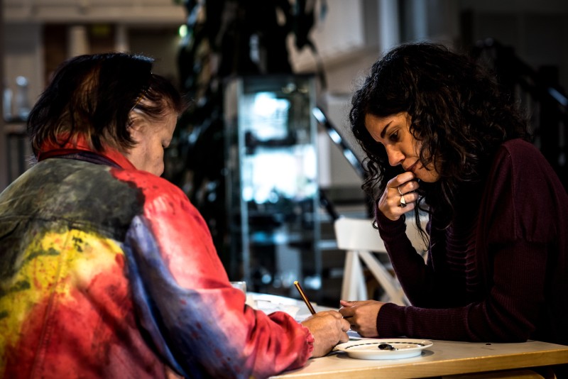 Two women talking at a table