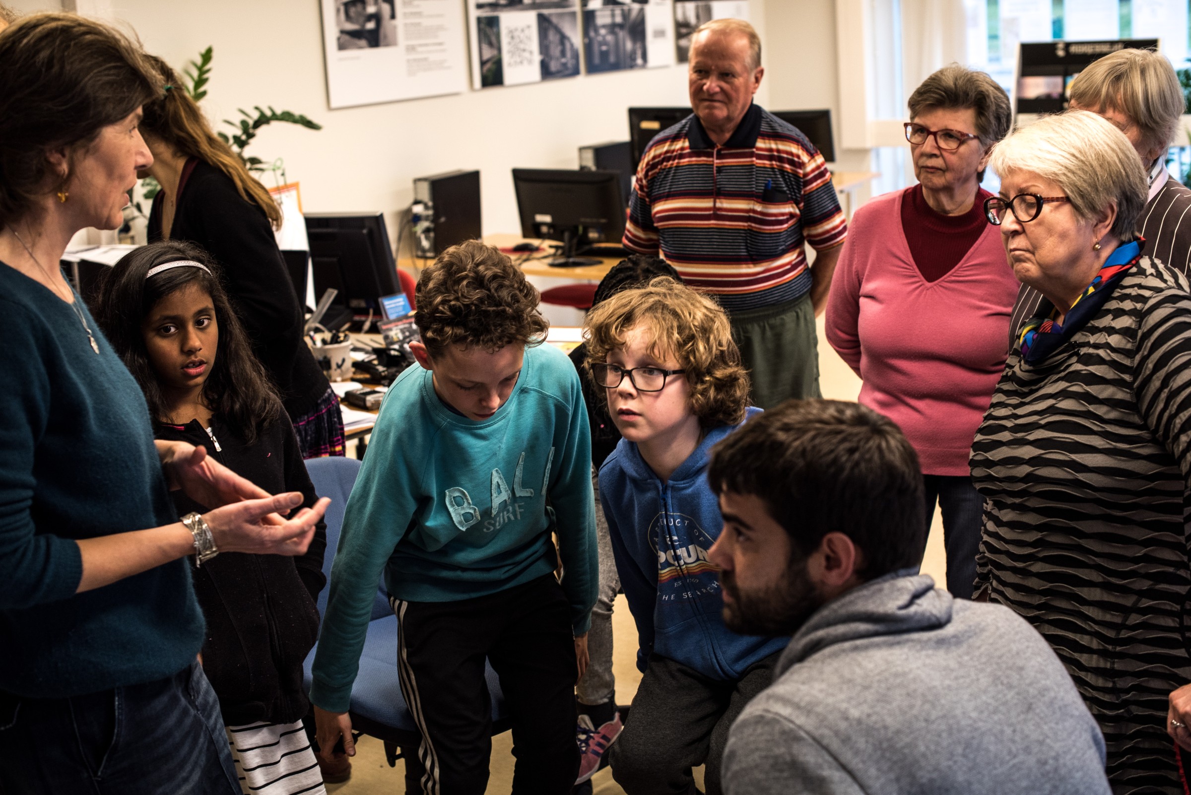 People listening a translation in Maunula-film workshop