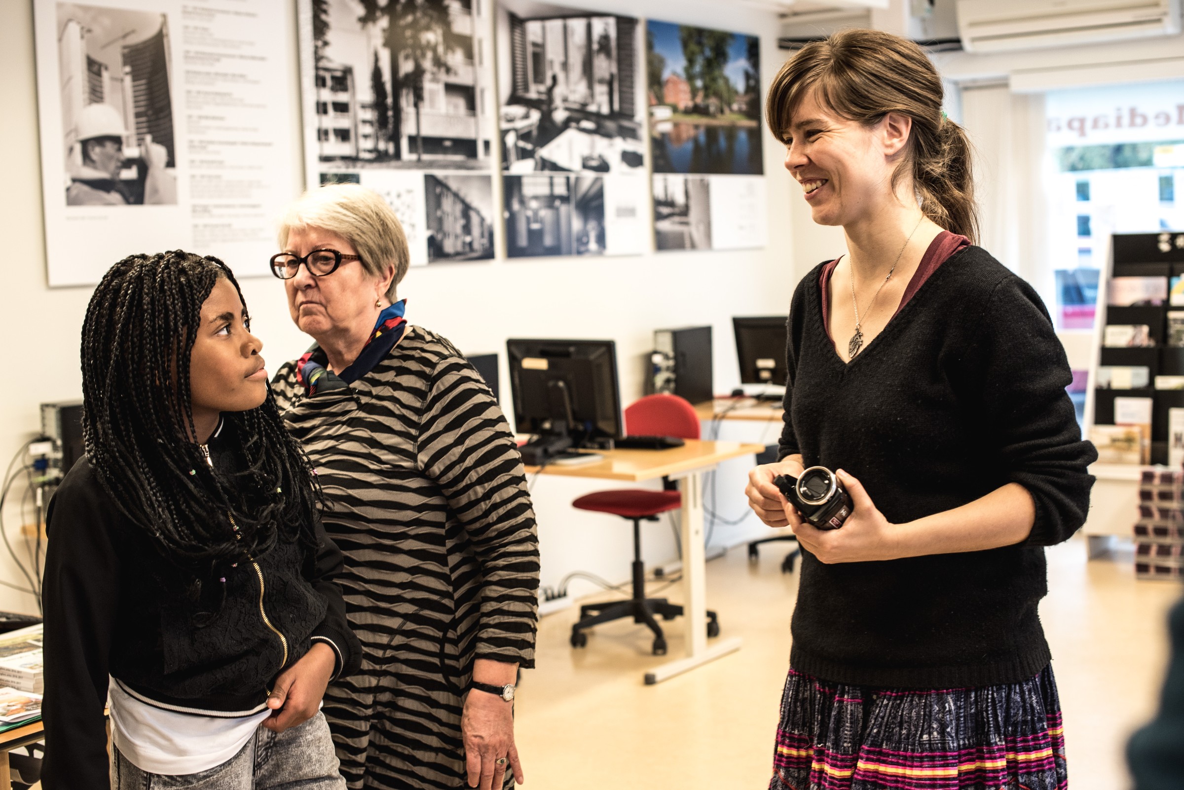 Riikka Kuoppala smiling with young participants