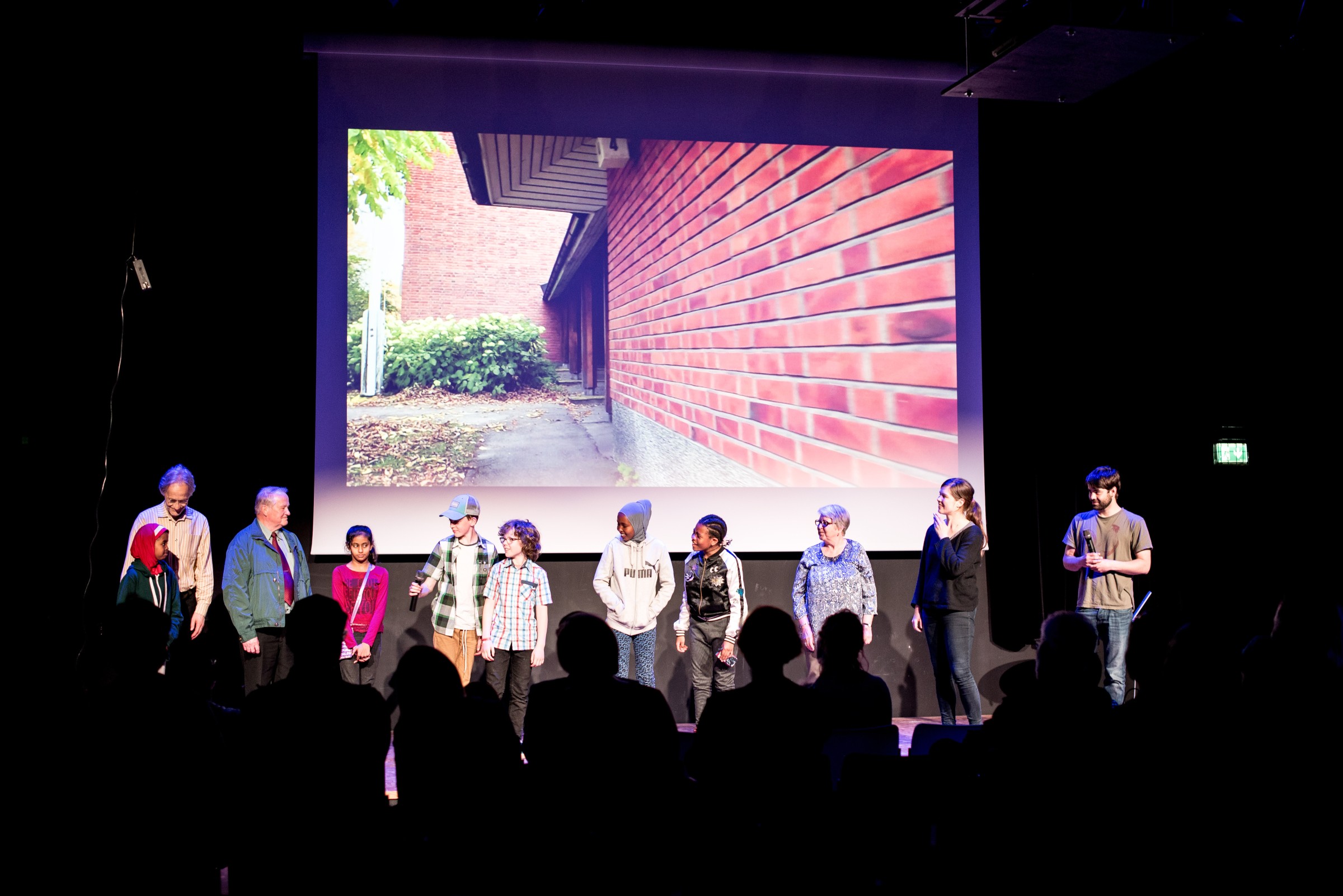 Maunula film participants on stage after premiere