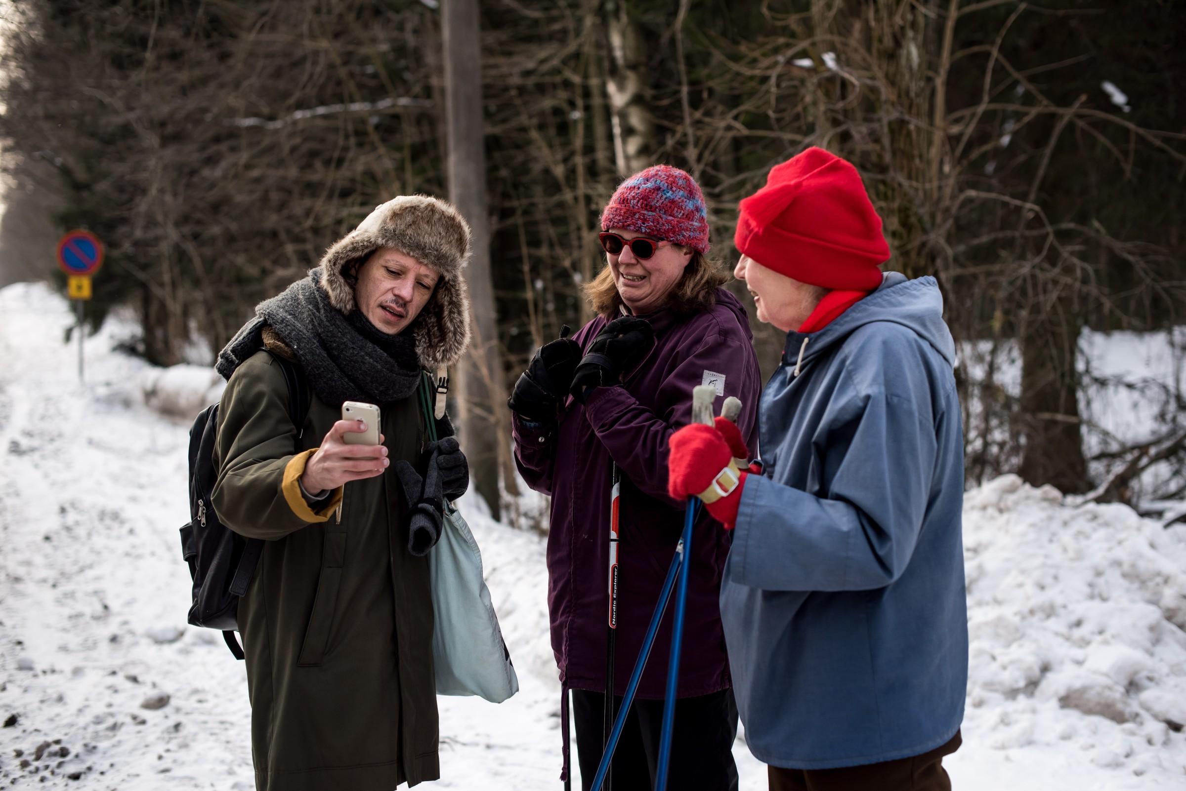Three people talking
