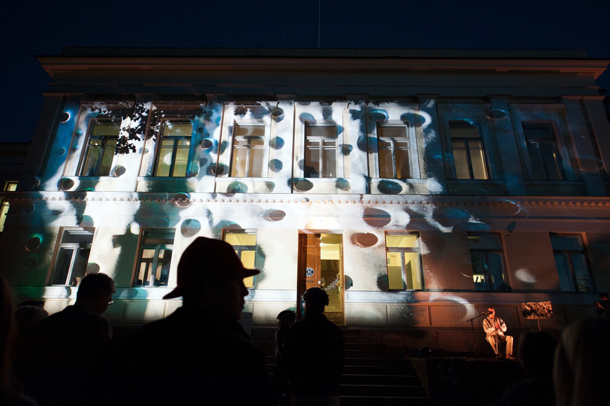 Tales from Frontiers facade projection and shadows of audience